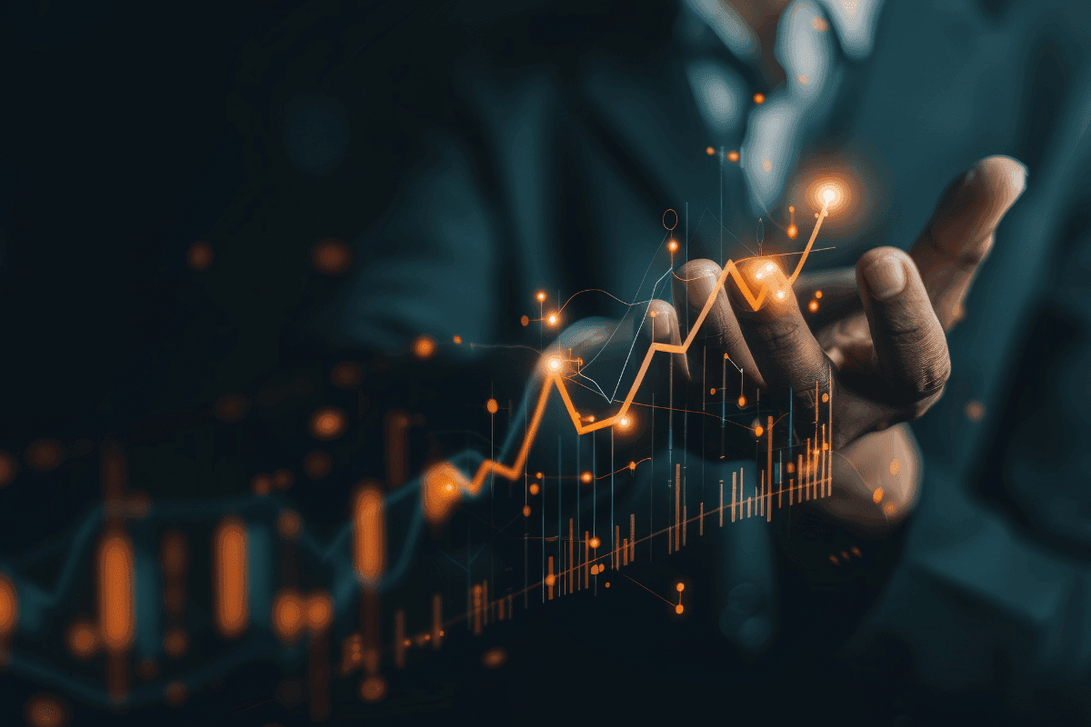 Executive tracking a rising performance graph, representing the measurement discipline at the core of an investment readiness framework.